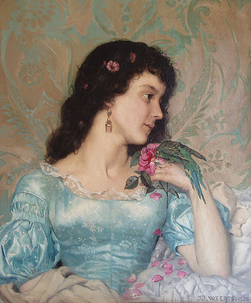 Beautiful pensive portrait of a young woman with a bird and flower